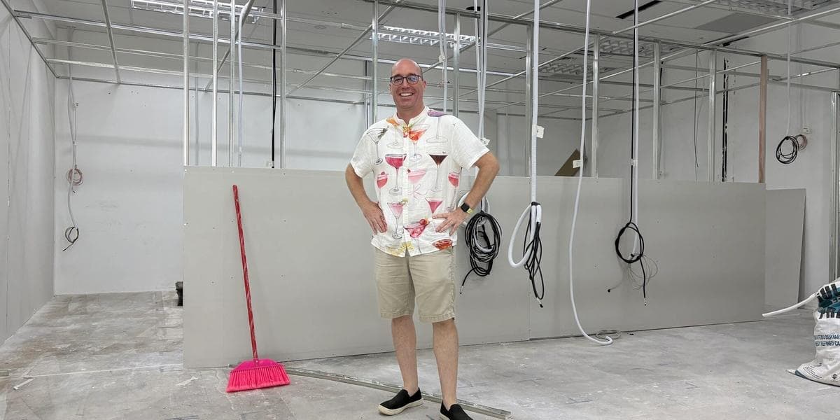Brian inside of a space that is being renovated