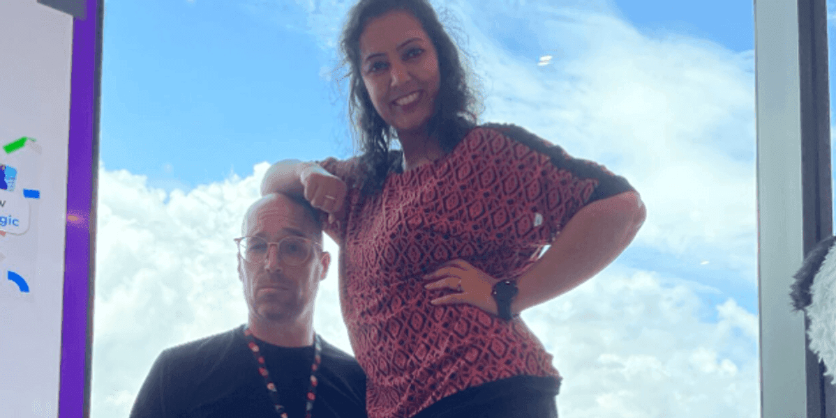 Brian, and his friend Neeta standing on a stool