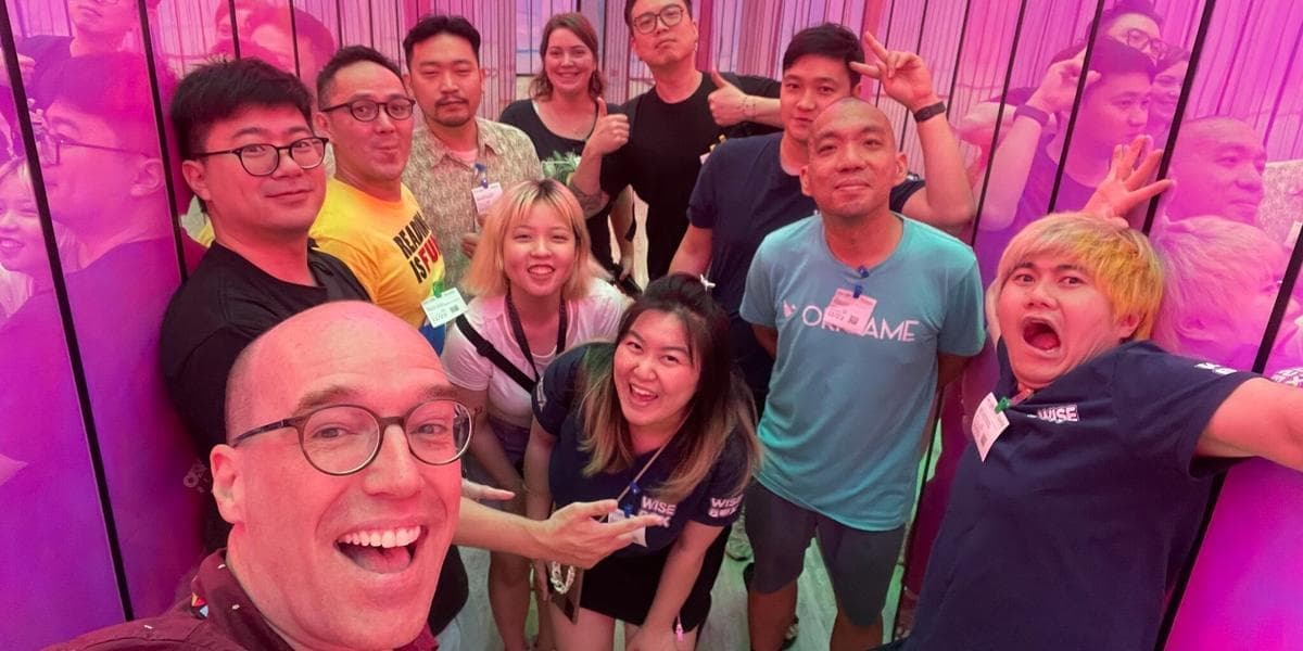 Brian and colleagues at Google inside a pink corridor