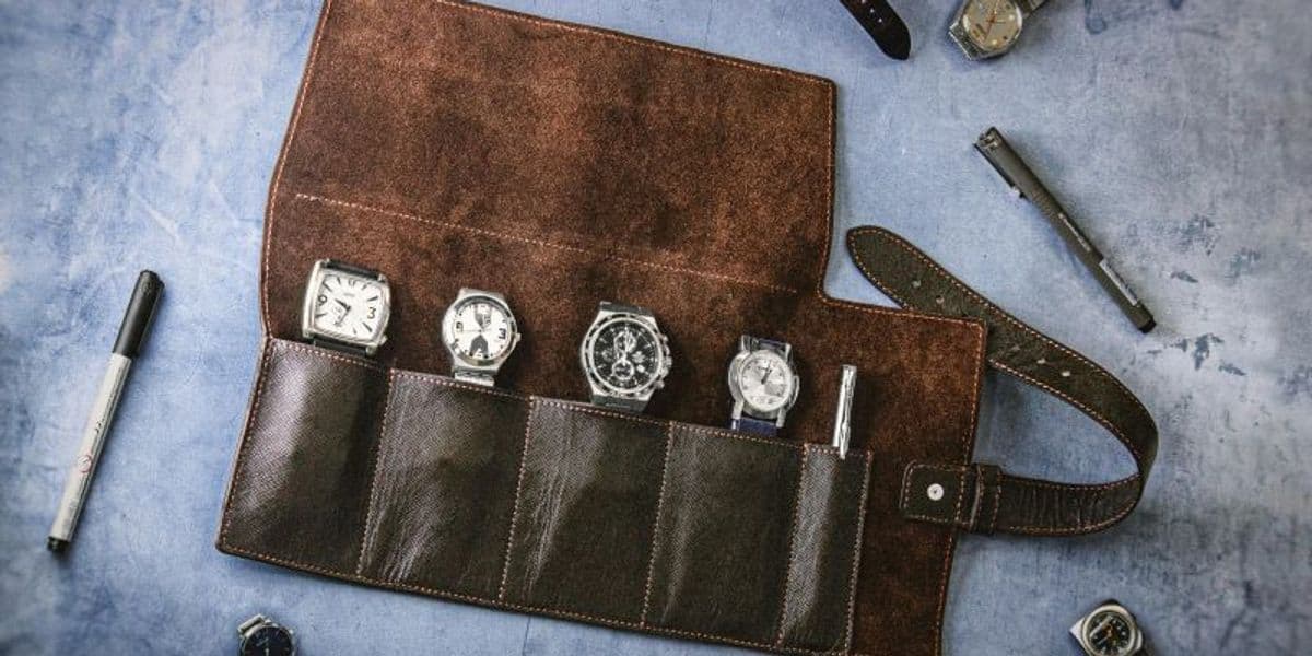 Picture of four watches, neatly organized in a special bag