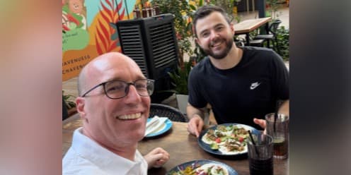 Brian and his friend Ryan at a restaurant