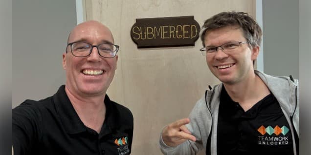 Brian and Tom in front of the entrance to the Submerged escape room
