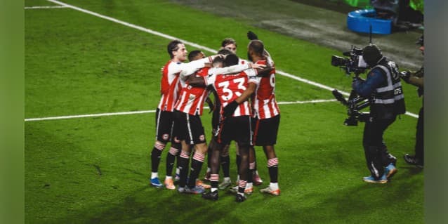 Football team celebrating on the pitch
