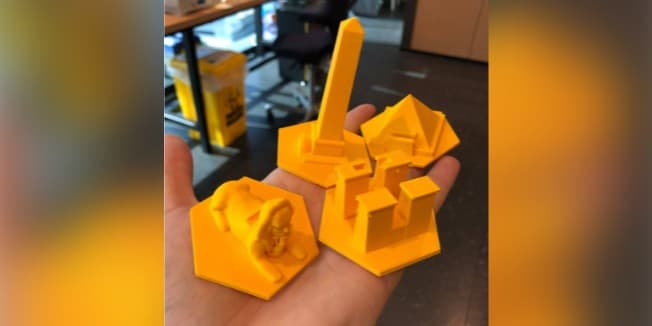 Board game pieces that Brian printed out in a 3D printer